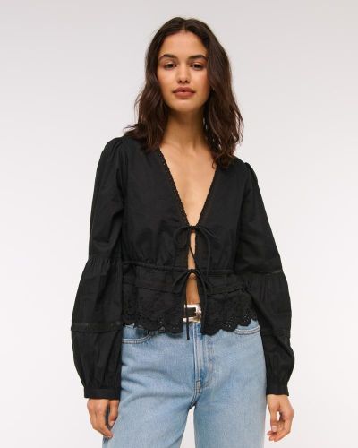 Top de encaje de manga larga con lazo frontal